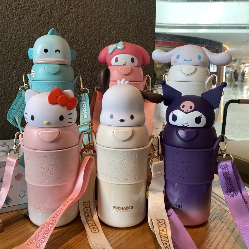 Set of colorful water bottles with cartoon designs on a wooden surface.
