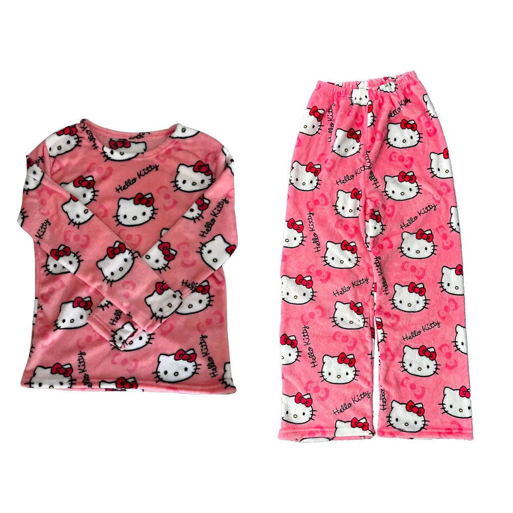 Pink Hello Kitty pajama set with shirt and pants on a white background
