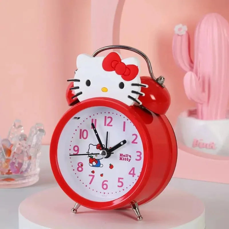 Red Hello Kitty alarm clock on a pink background