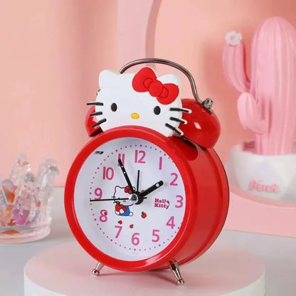 Red Hello Kitty alarm clock on a pink background