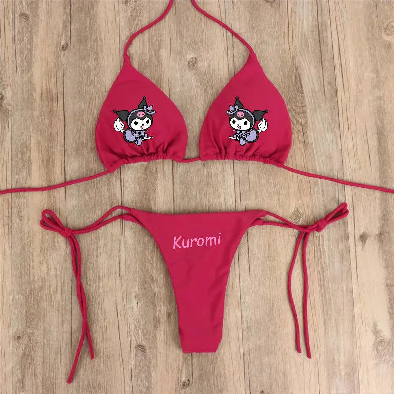 Red bikini set with cartoon character design on a wooden surface