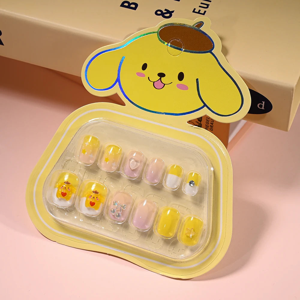 Set of cartoon-themed false nails in a yellow case with a dog design on a pink background