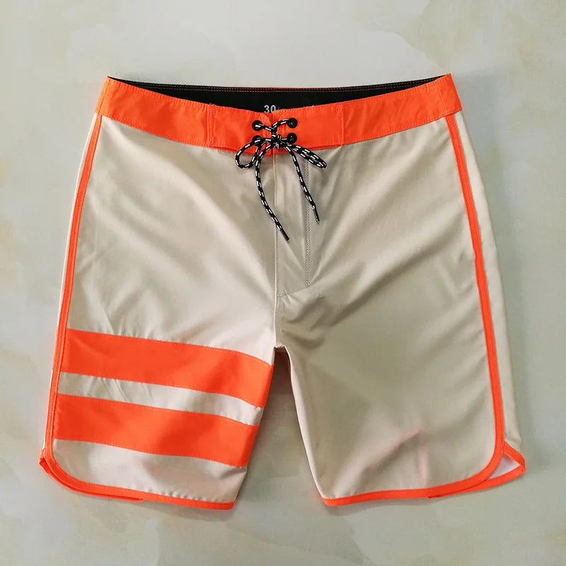 Beige shorts with orange accents on a white background
