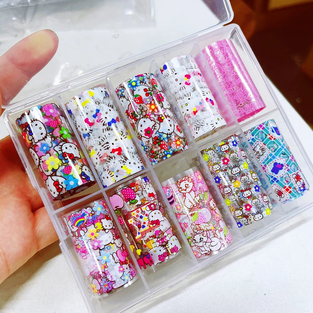 Set of colorful nail art designs in a clear plastic case held by a hand.