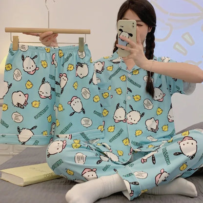 Woman wearing a matching pajama set with cartoon characters on a light blue background.