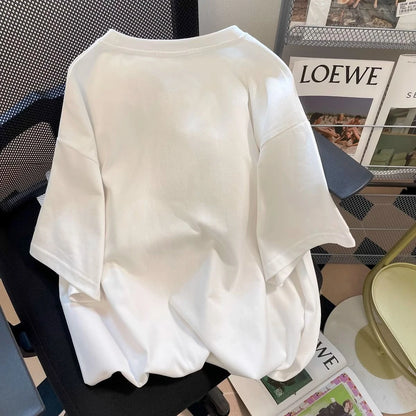 White blouse on a chair with a magazine in the background