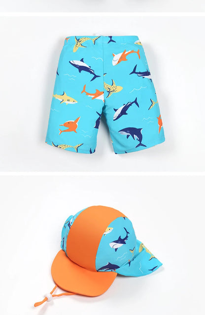 Children's swim shorts and cap with shark pattern on a white background