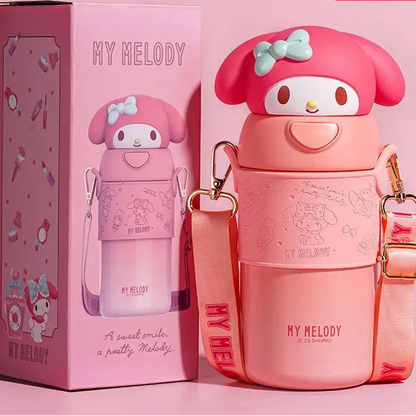 Pink water bottle with character design and matching box on a pink background