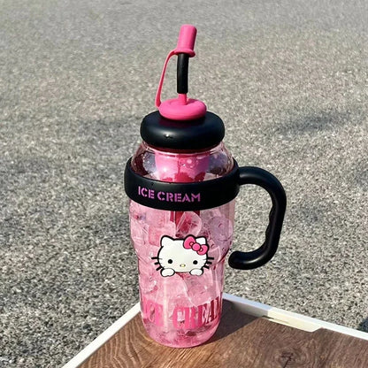 Pink water bottle with black handle and straw lid on a textured surface