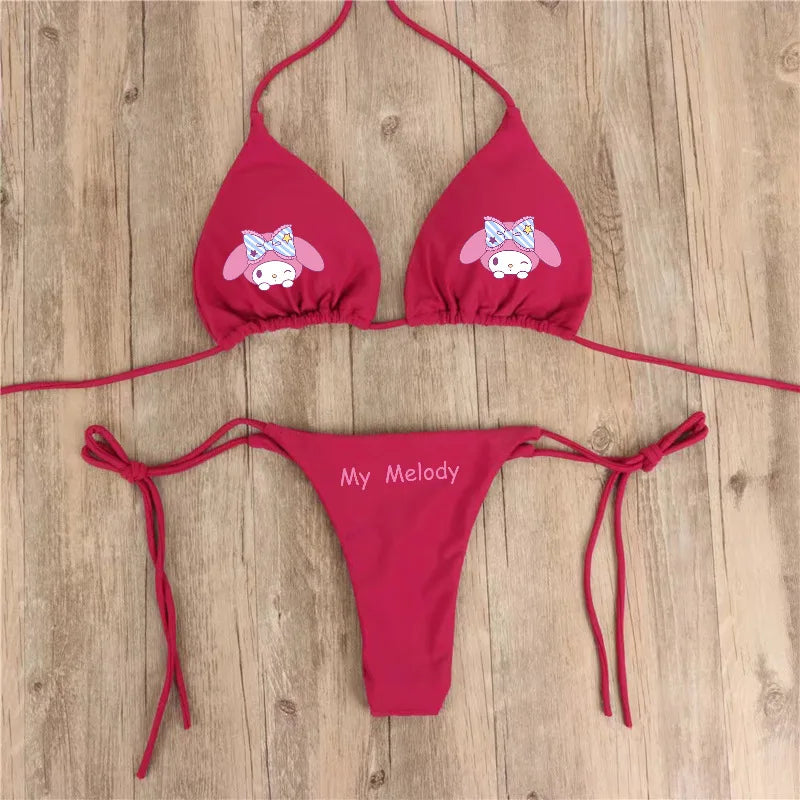Red bikini set with cartoon character design on a wooden surface
