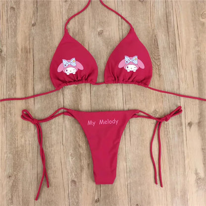 Red bikini set with cartoon character design on a wooden surface