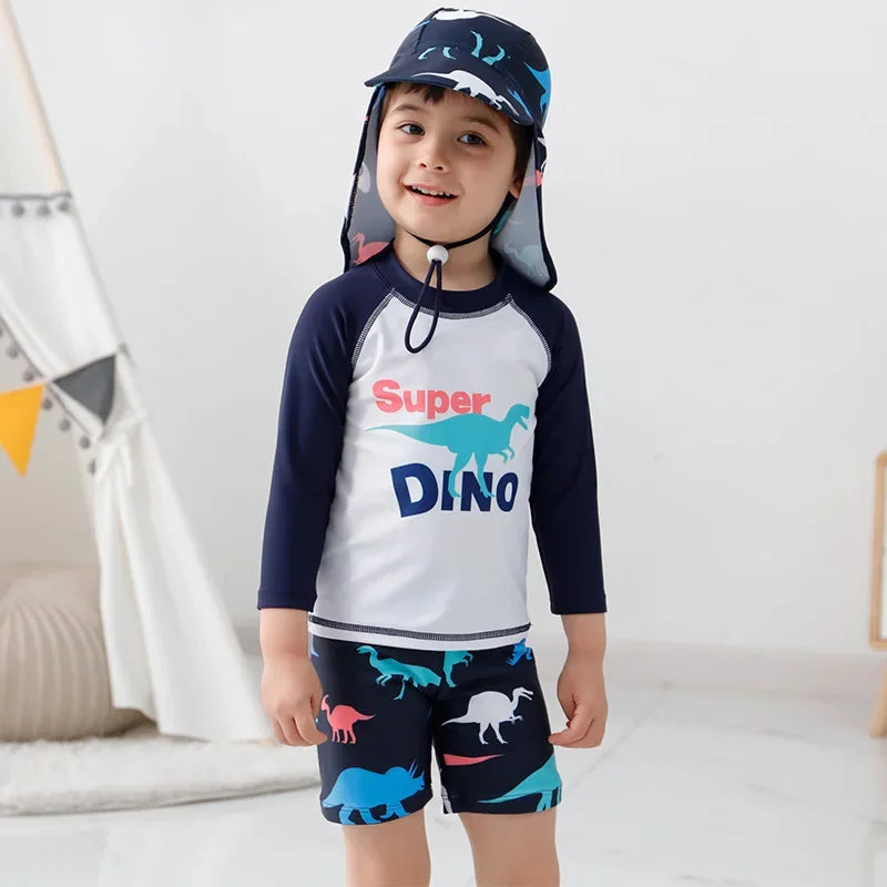 Child wearing a dinosaur-themed swimsuit and cap indoors