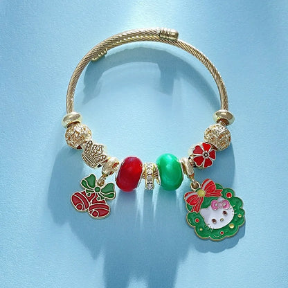 Gold bracelet with colorful charms on a light blue background