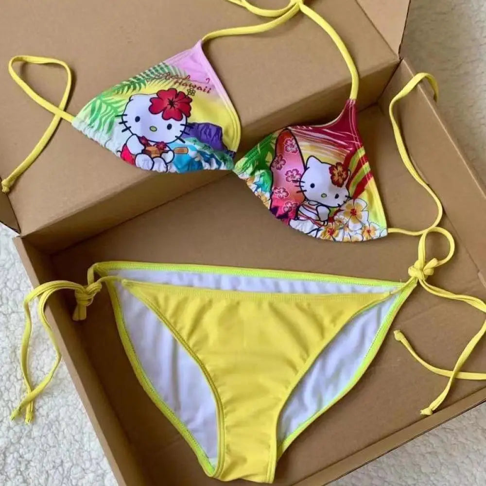 Colorful bikini set with Hello Kitty design on a cardboard box