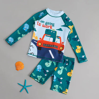 Children's swimsuit set with car design and text on a gray background