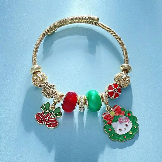 Gold bracelet with colorful charms on a light blue background