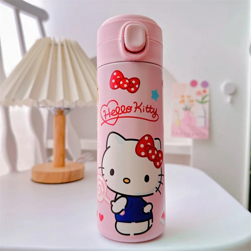 Hello Kitty-themed pink water bottle on a white surface with a blurred background