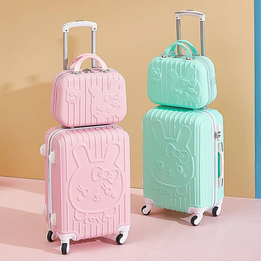 Set of pink and green suitcases with bunny designs on a beige background