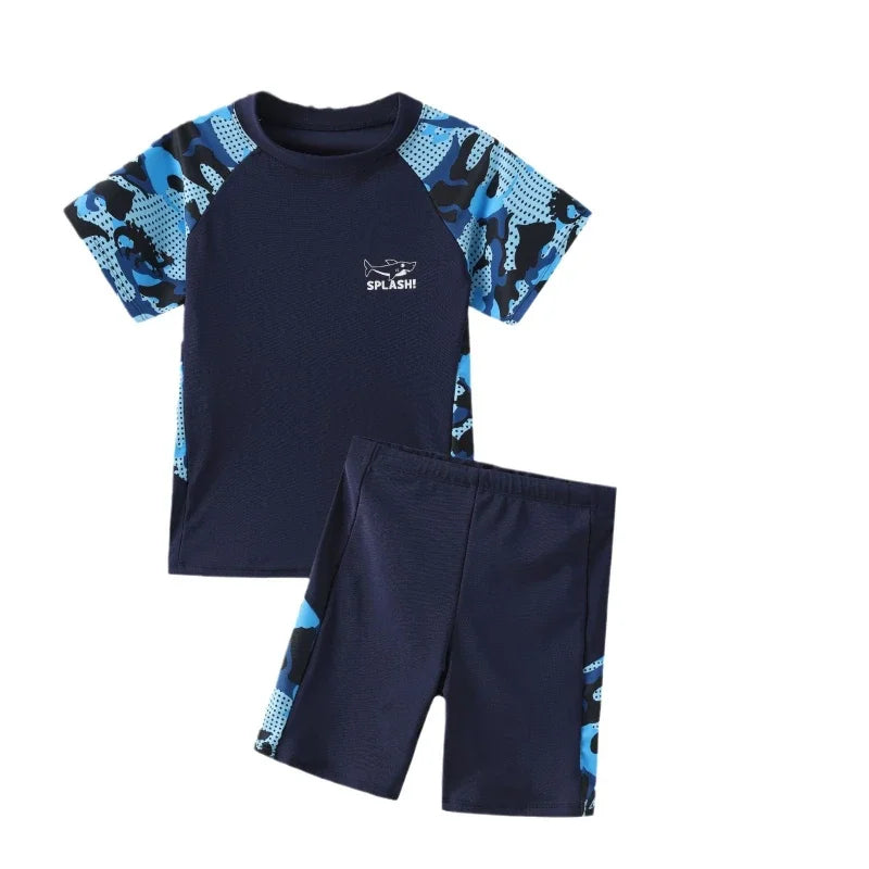 Navy swim set with blue camouflage sleeves and shorts on a white background
