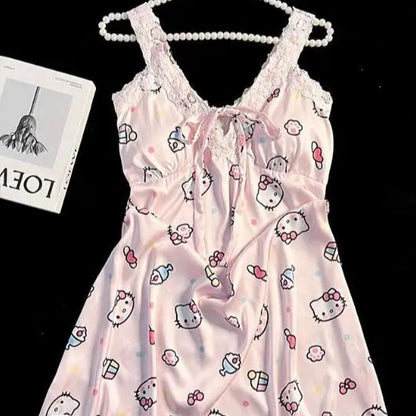 Pink babydoll dress with cartoon print on a hanger against a black background