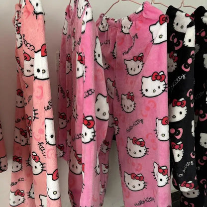 Pink pajama pants with Hello Kitty pattern on a rack.