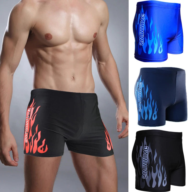 Man wearing black swim shorts with flame design, alongside additional designs on a gray background.