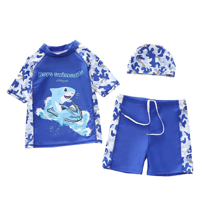 Blue and white boys' swim set with shark design on a white background