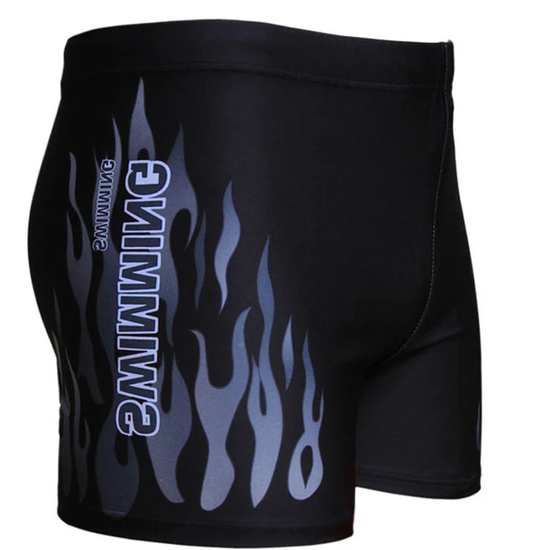 Black shorts with flame design and 'Gimme' branding on a white background