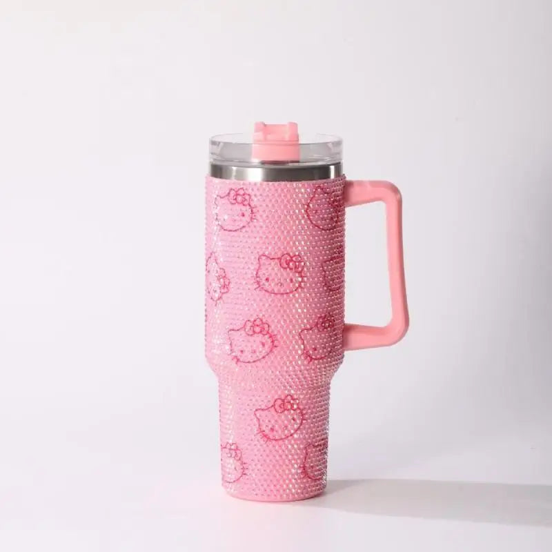 Pink tumbler with a handle and hello kitty design on a white background