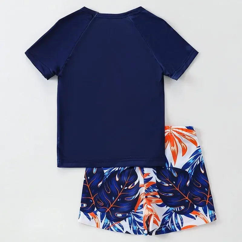 Navy blue shirt and leaf-patterned shorts on a white background
