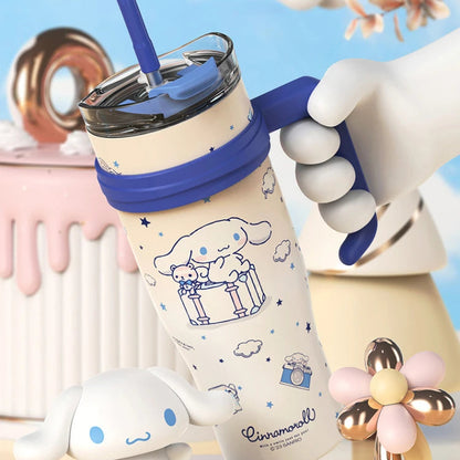 Tumbler with cartoon design held by a hand against a colorful background