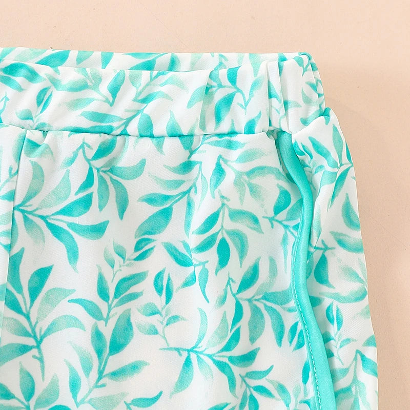 Close-up of a skirt with a green leaf pattern on a beige background