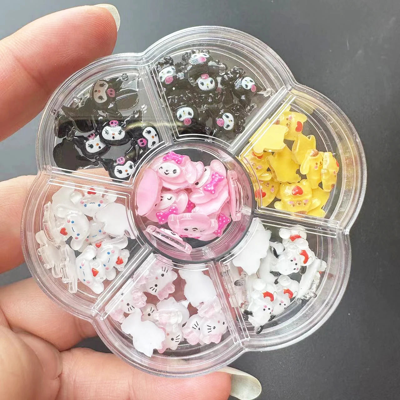 Heart-shaped container with nail art decorations including cats, dogs, and bears.