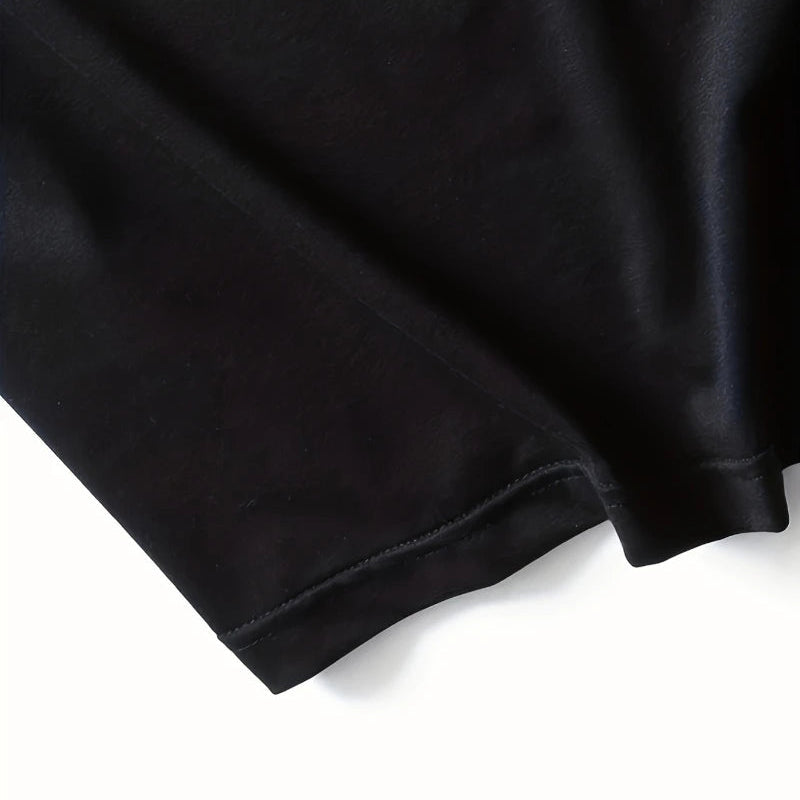 Close-up of a black fabric with a pink 'Somrio' logo in the corner.