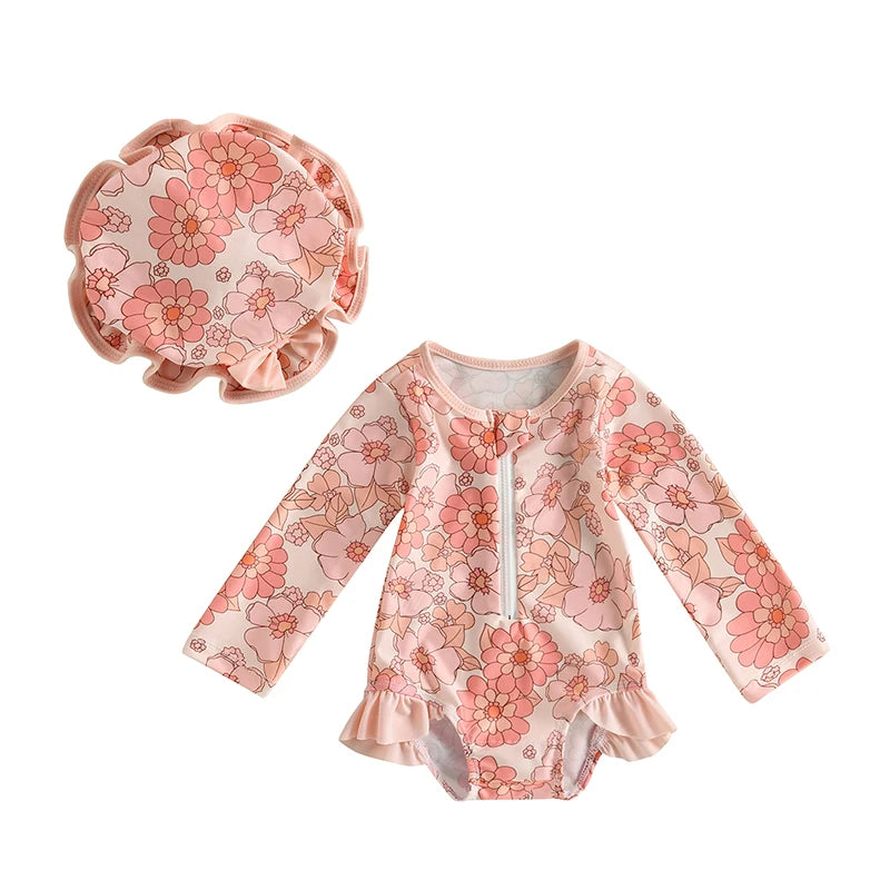 Floral baby outfit with long-sleeve top and matching hat on a white background