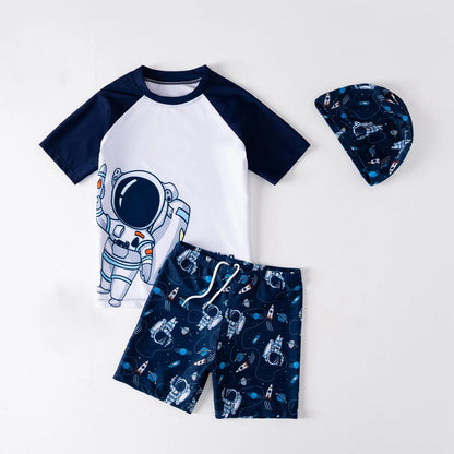 Children's outfit with astronaut-themed shirt, shorts, and hat on a white background