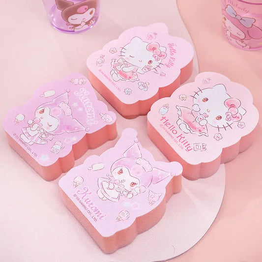 Pink and white Hello Kitty-themed sponges on a light pink background