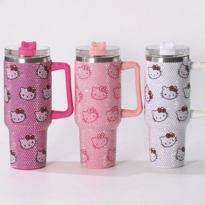 Three pink and white tumblers with Hello Kitty designs on a white background