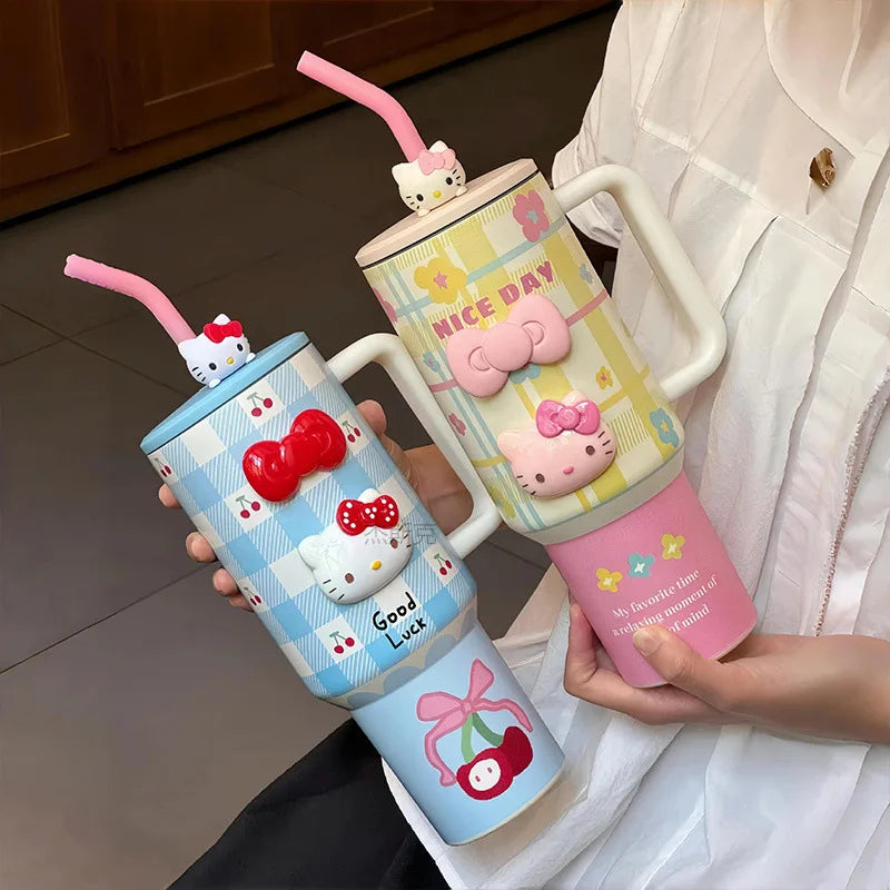 Three colorful tumbler cups with cartoon designs held by a person.