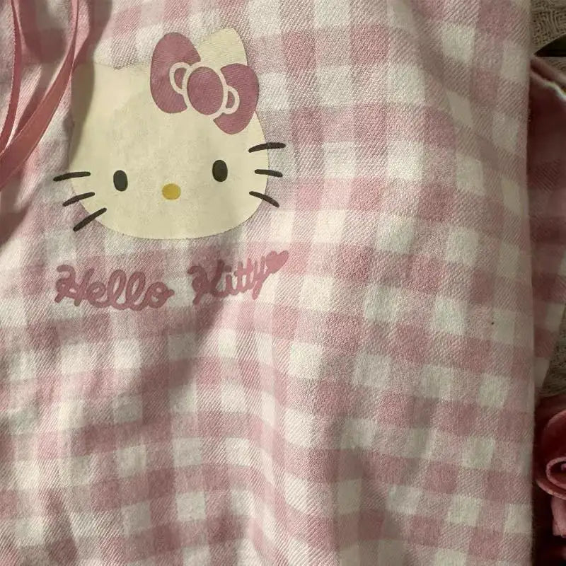 Pink and white checkered fabric with Hello Kitty logo