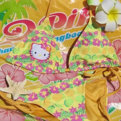 Colorful swimsuit with floral pattern and cartoon character on a yellow background