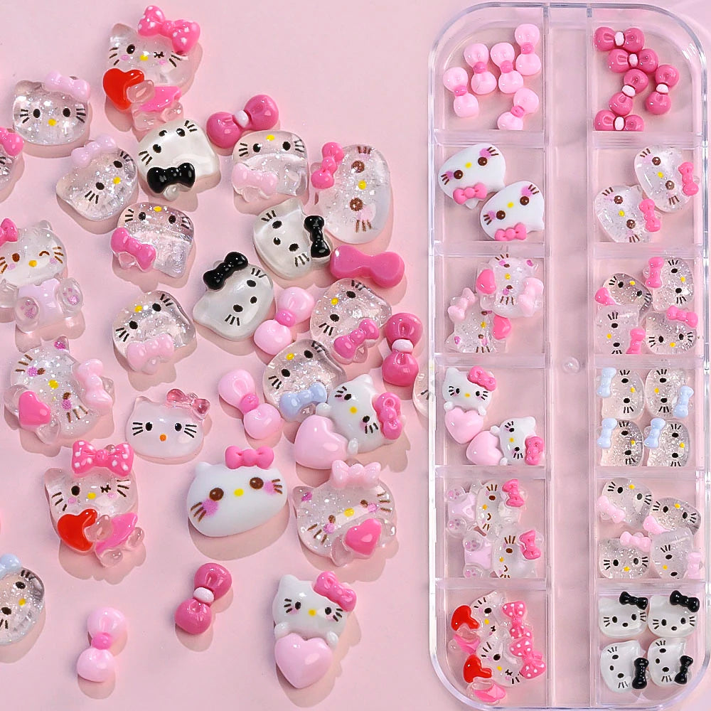 Hello Kitty-themed nail art decorations on a pink background
