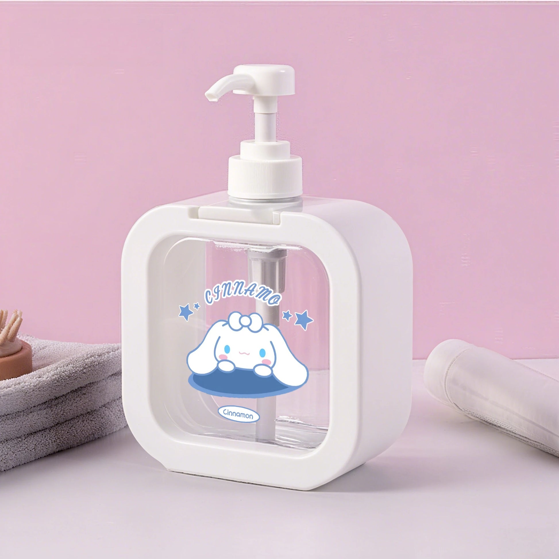 White soap dispenser with cartoon character on a pink background