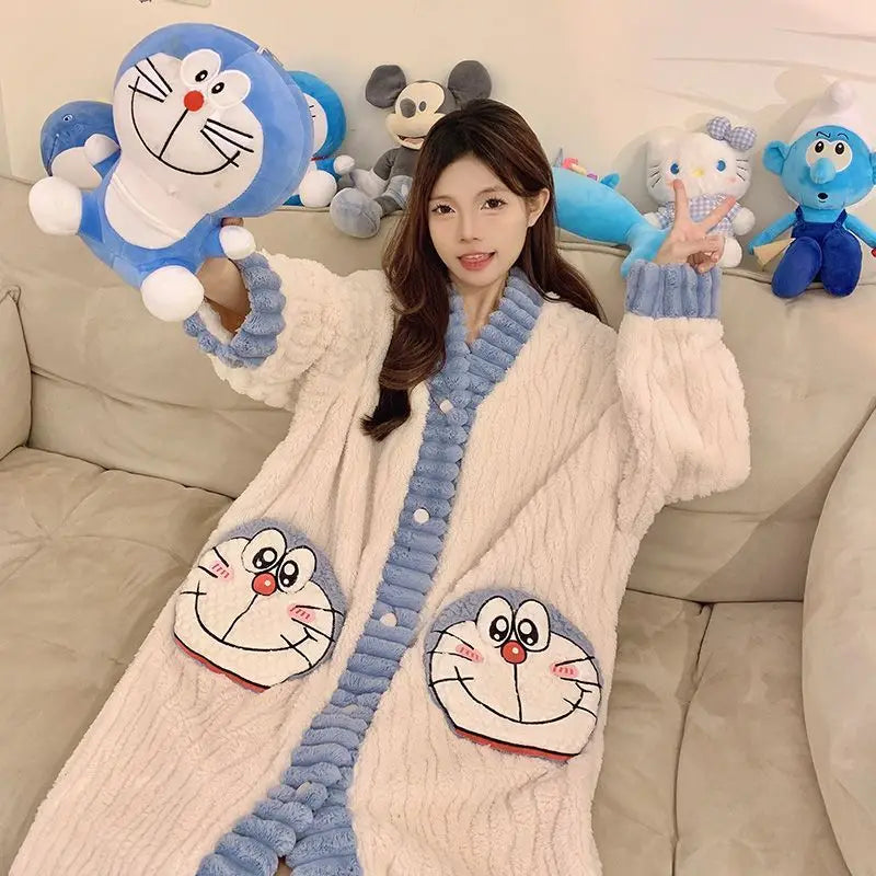 Person wearing a cozy robe with cartoon character designs on a couch