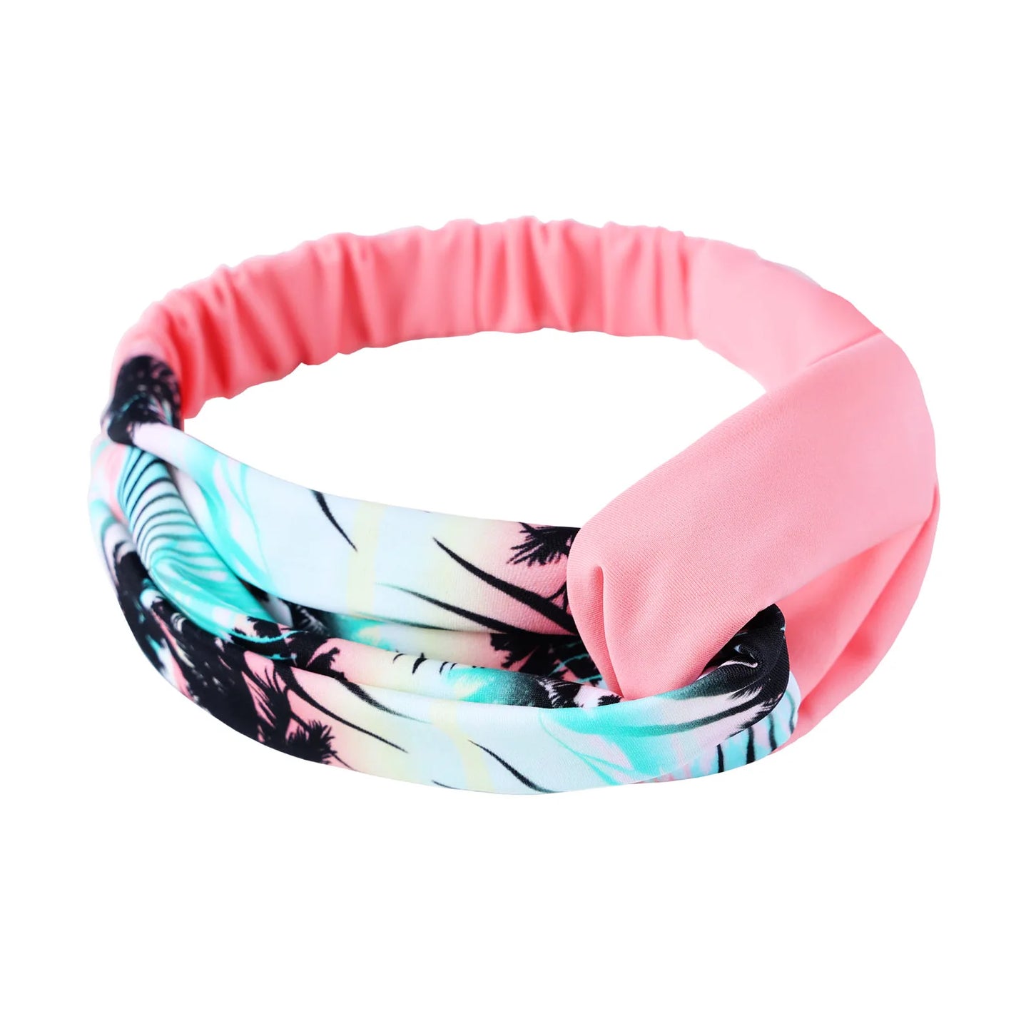 Headband with pink exterior and tropical patterned interior on a white background