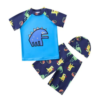 Children's swimsuit set with blue top and navy shorts featuring dinosaur patterns on a white background.