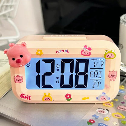 Children's digital clock with cartoon design on a desk