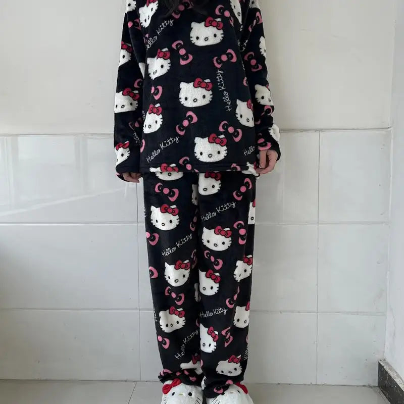 Person wearing Hello Kitty-themed pajamas against a tiled wall.