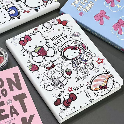 Notebook with Hello Kitty design on a gray surface