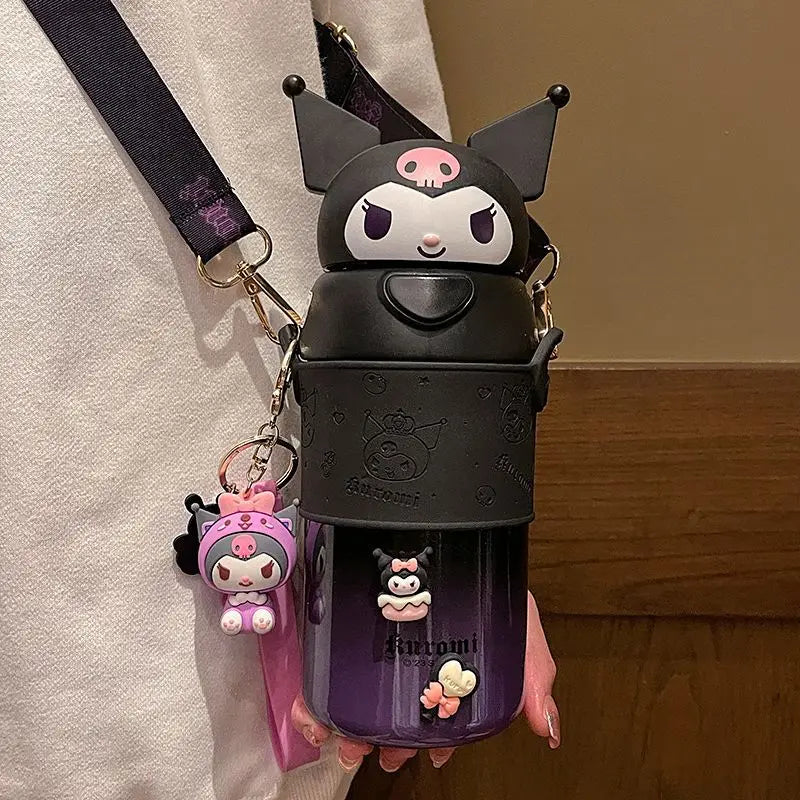 Black and purple water bottle with cartoon character design held by a person.